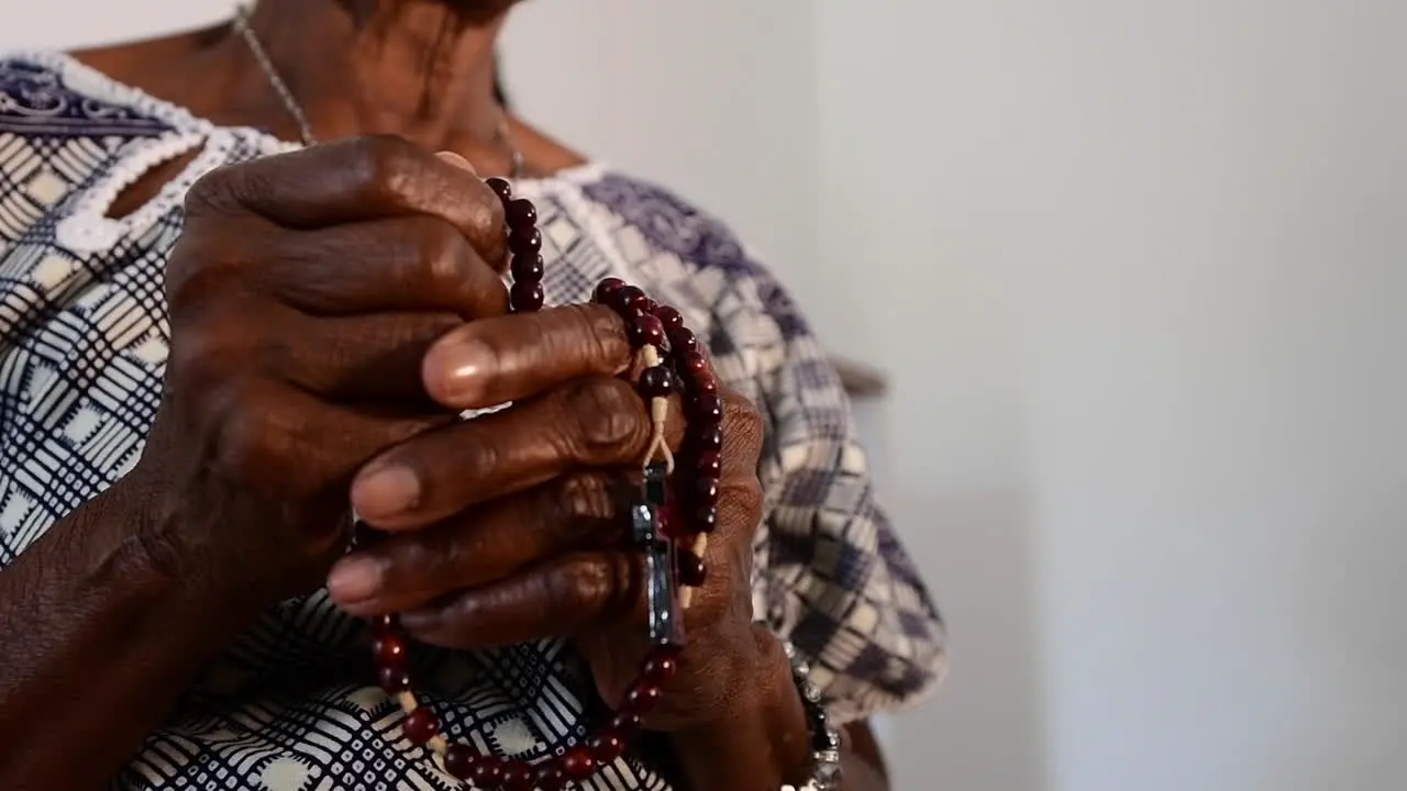 tired hands praying the rosary