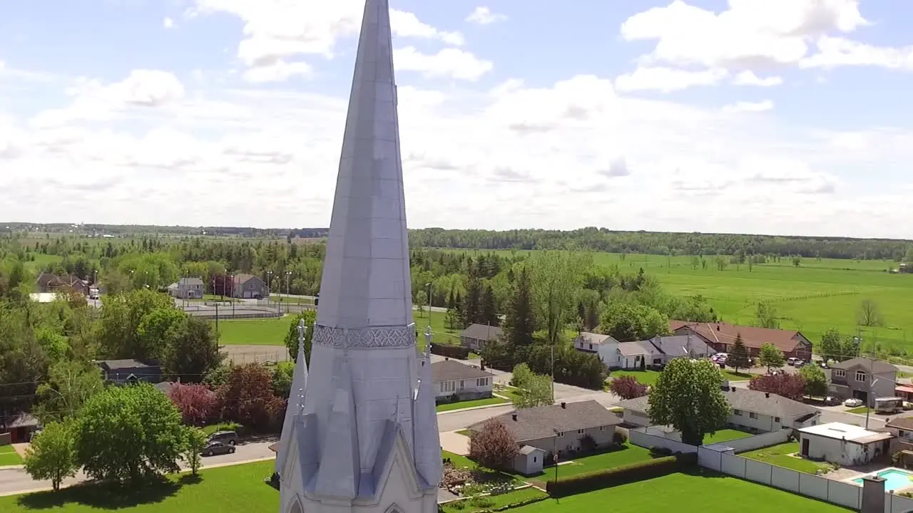 Aerial shot rising beside Catholic church in rural Quebec Canada