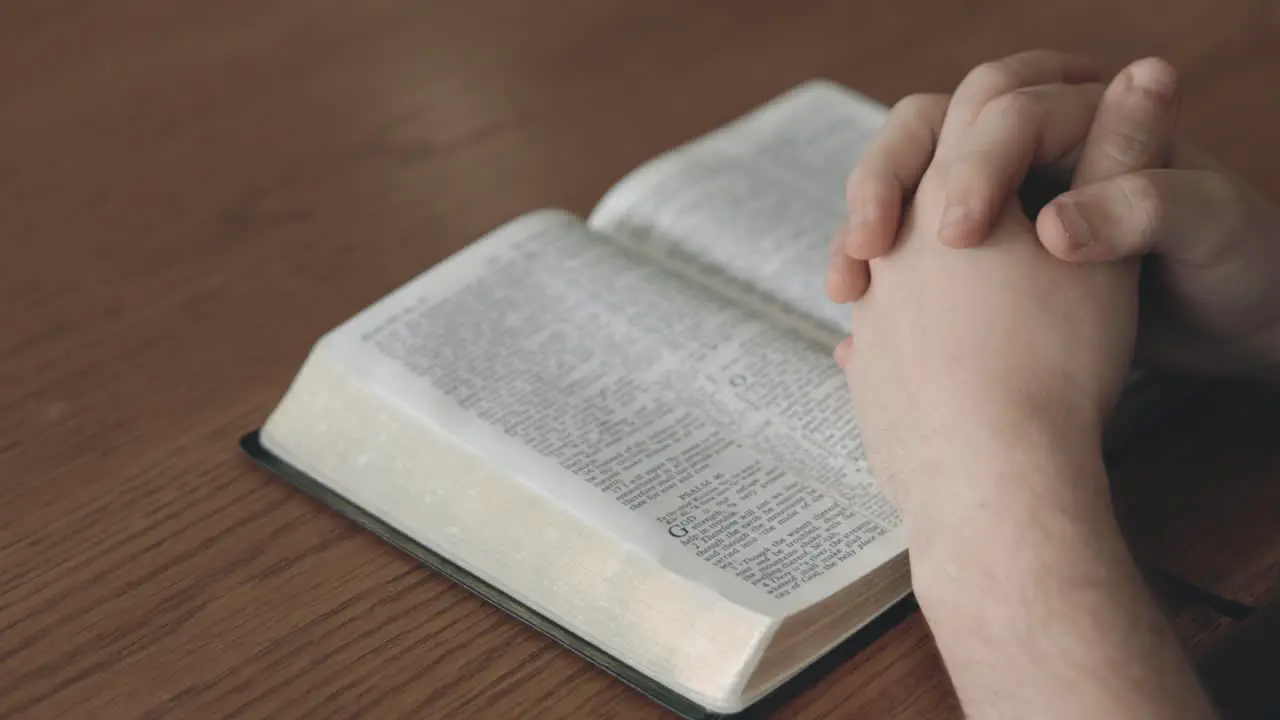 Man Hands Bible Book And Prayer In Home Of Spiritual Faith Holy Gospel