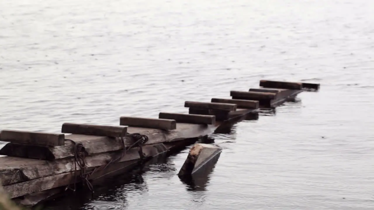 Rain drops falling on a pier