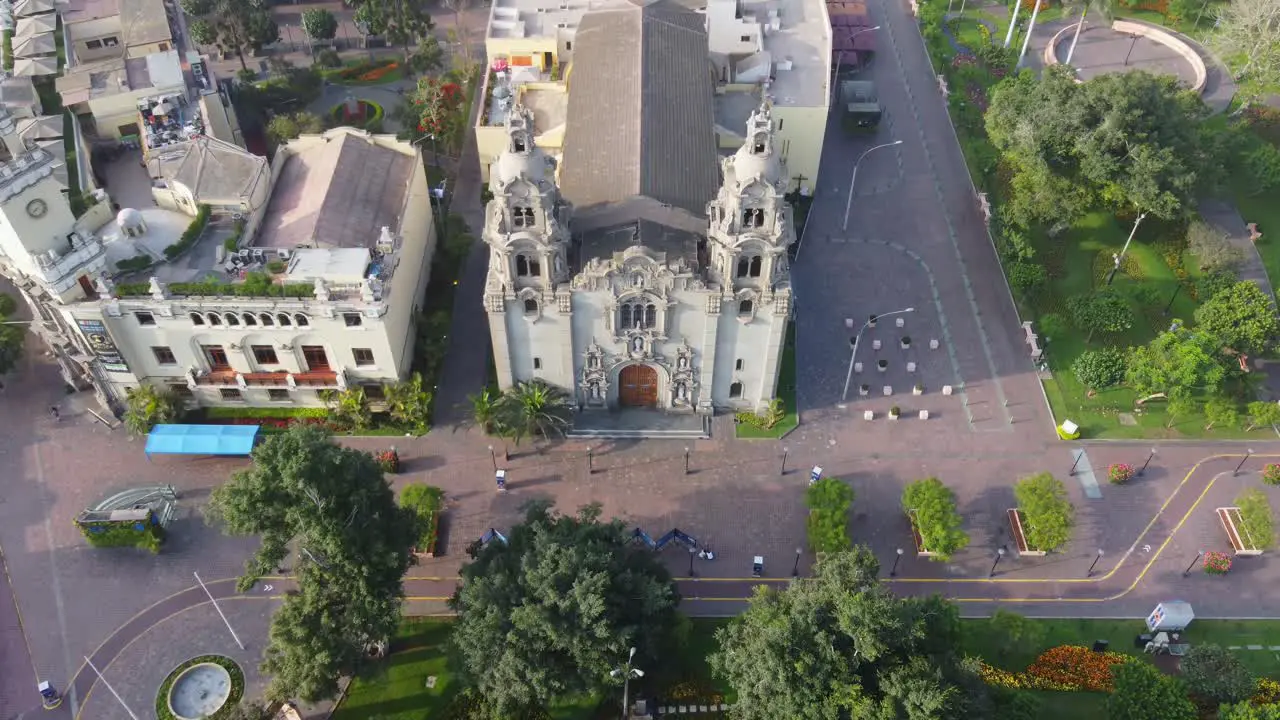 Drone video of church in Miraflores district of Lima Peru near "Parque Kennedy" The shot is recorded while flying down and tilting camera up