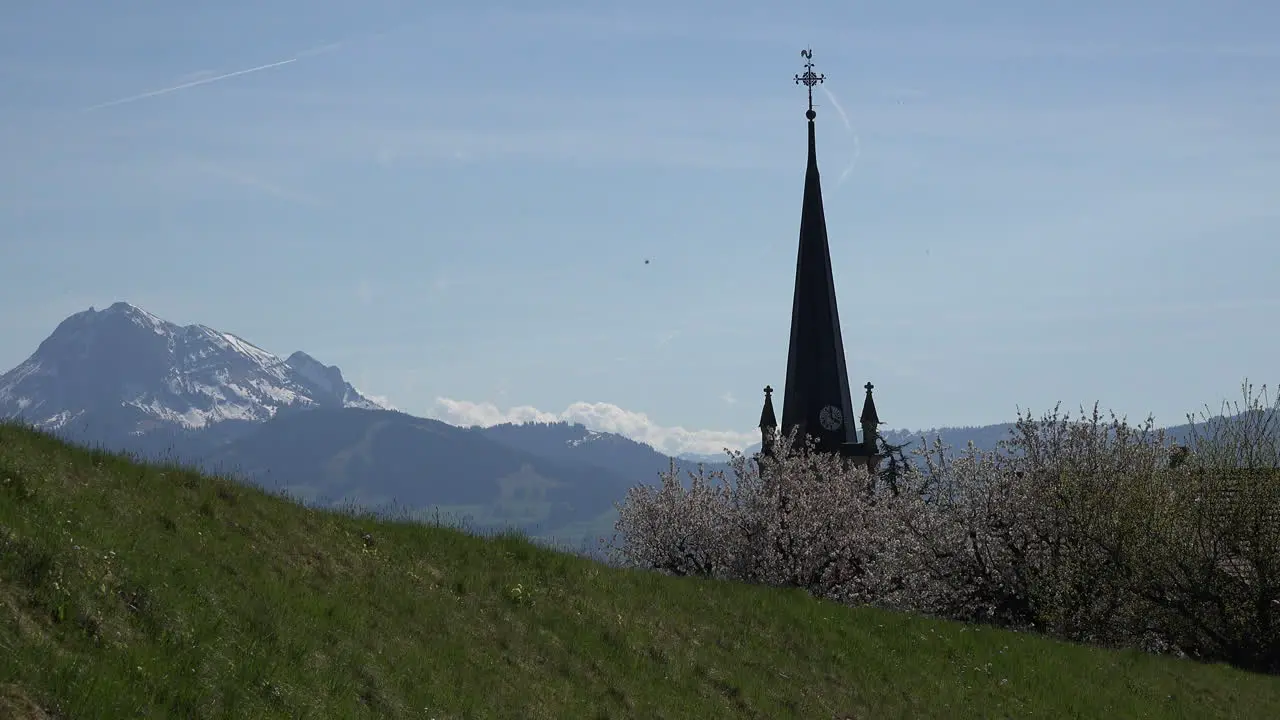 Switzerland La Gruyere View Of Alps Beyond Church Steeple