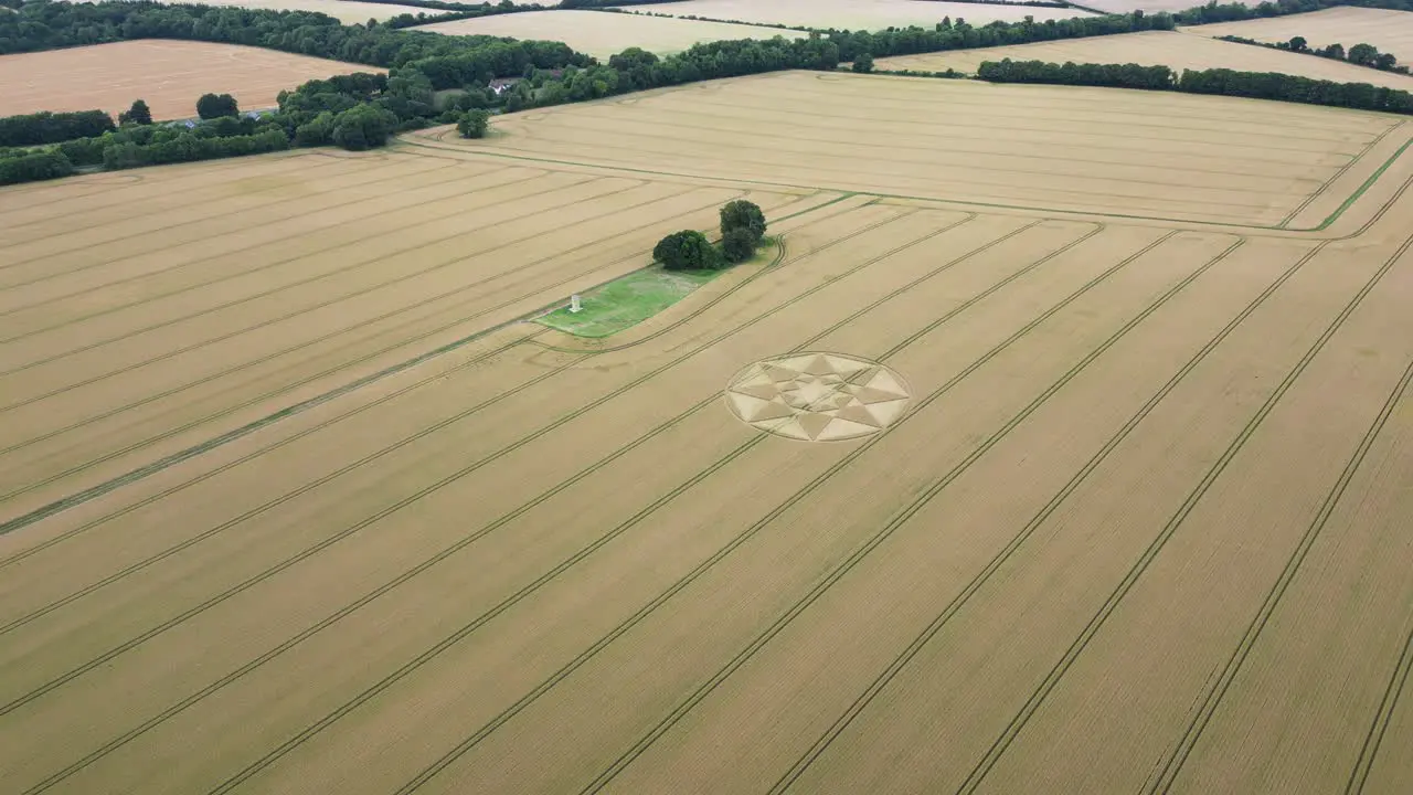 Establishing aerial view Micheldever crop circle patterns formed into rural Hampshire farmland cornfield