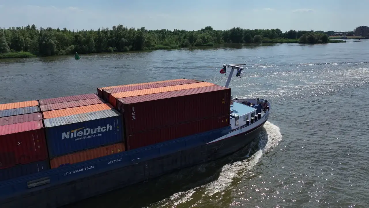 River Sailing Cargo Ship and Containers in Zwijndrecht