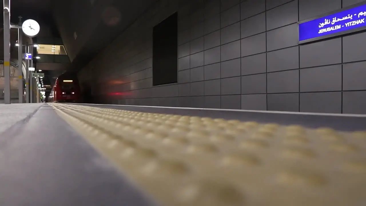 Timelapse of a train approaching and stopping at the railway station