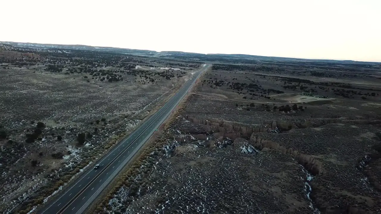 Drone flight over a highway going through the New Mexican desert