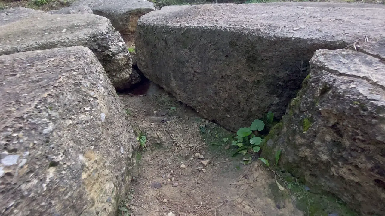 Close Up Gimbal Shot of excavated Stones and manmade Concrete materials and textures on top of the Bosnian sun pyramid