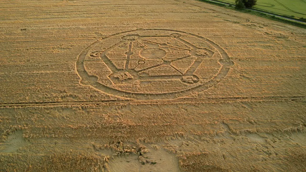 Fortnite game molecular crop circle pattern aerial view in Uffcot farmland wheat field low slow orbit right