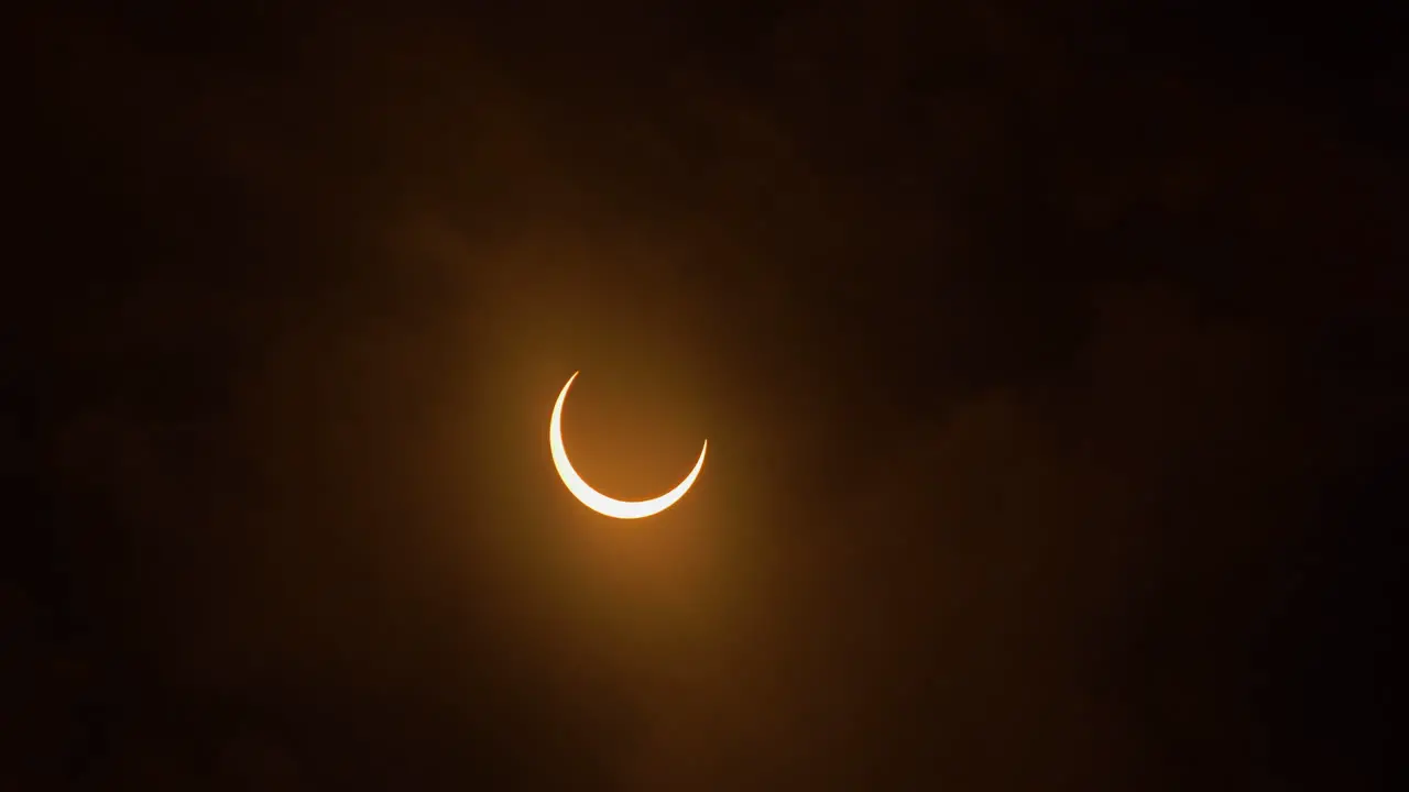 Timelapse of an annular solar eclipse entering totality with clouds October 14th 2023