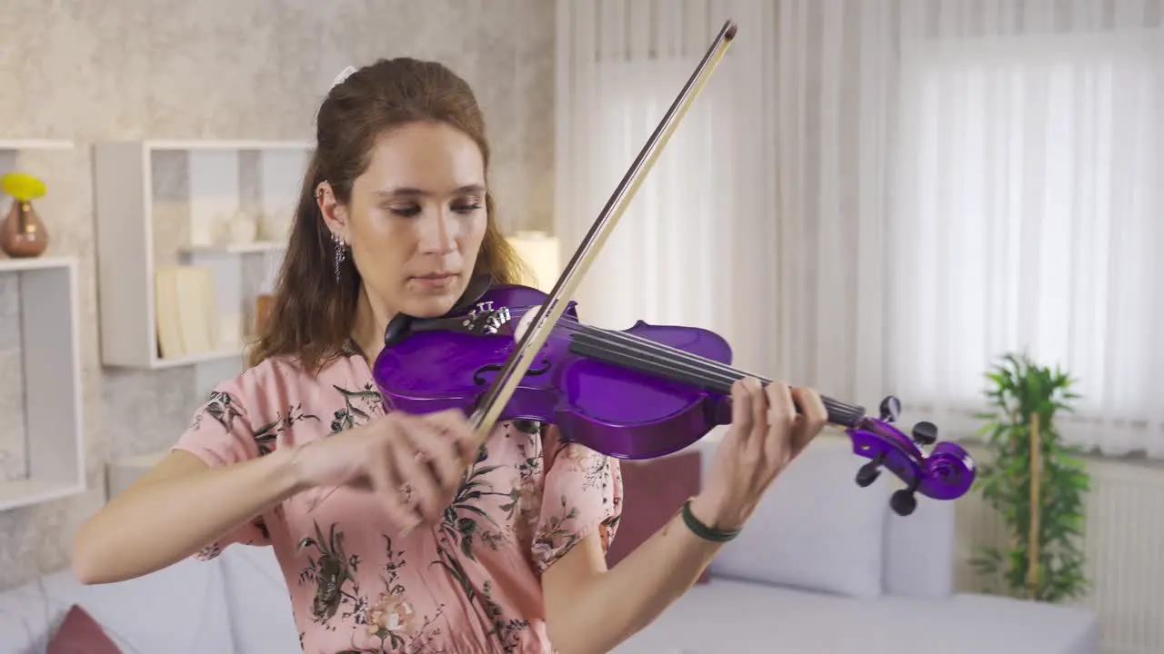 Musician woman playing the violin at home Violinist Music teacher