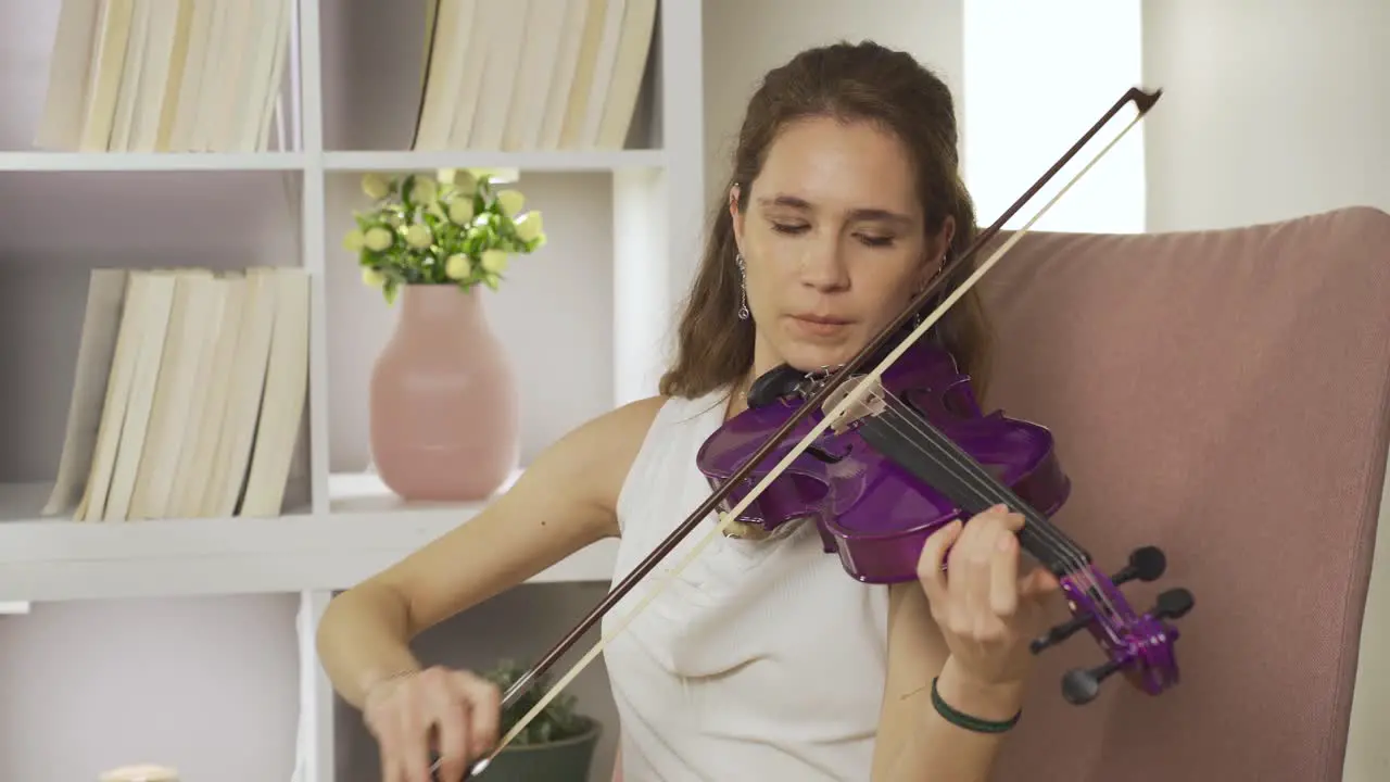 Talented violinist young woman playing the violin Music spirit