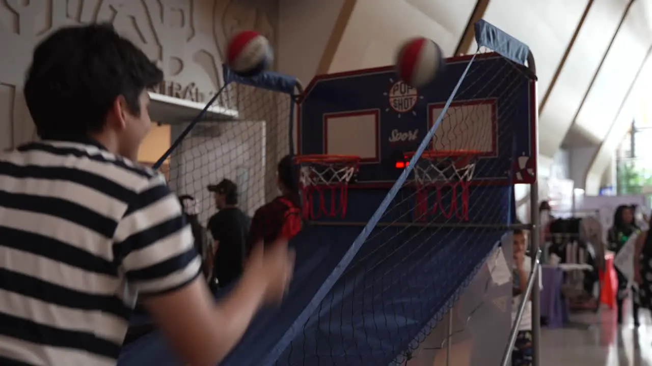 Young Men Playing Basketball Game at Costa Rica Connecturday Convention