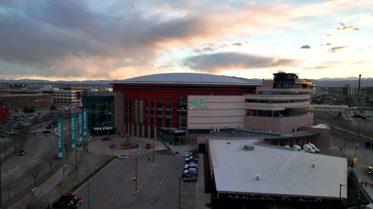 Twilight aerial view of Ball Arena in Denver Colorado arcing shot