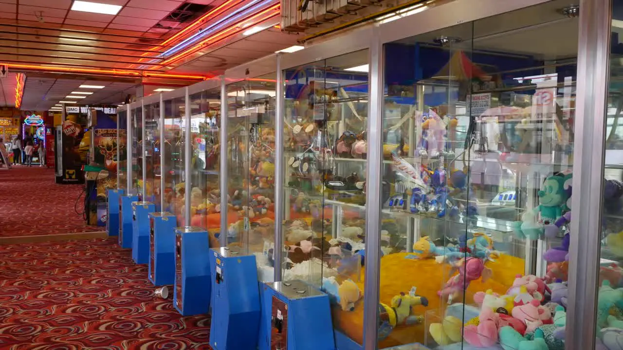 Row of amusement arcade grabber machines