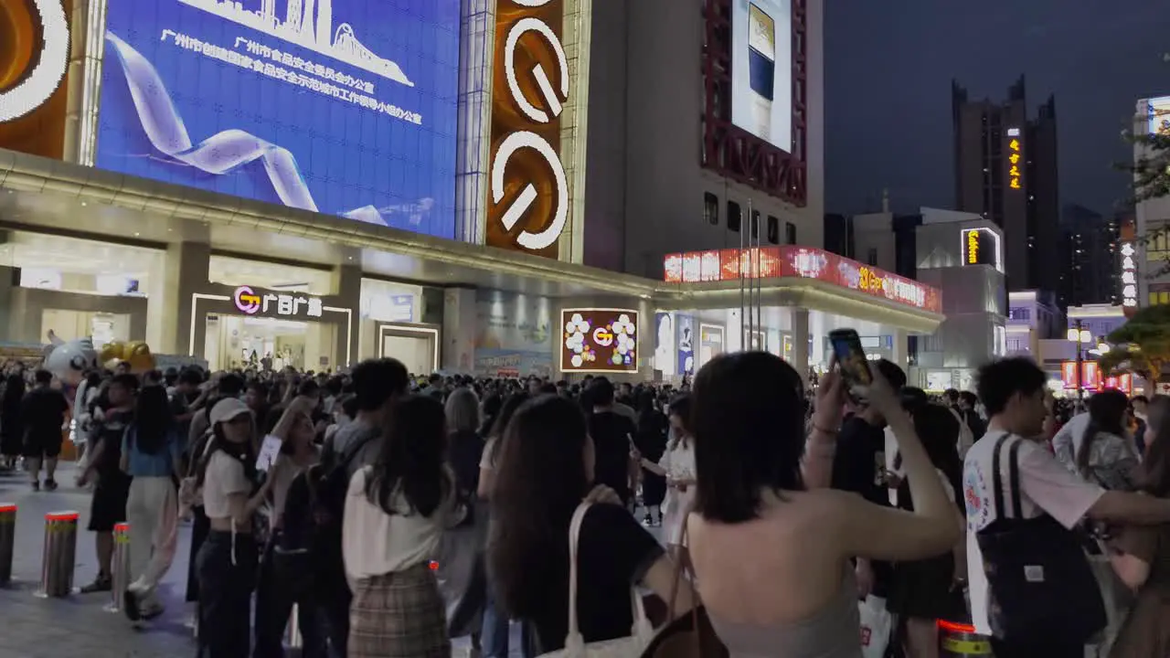 Busy crowded night street in Asia Guangzhou China