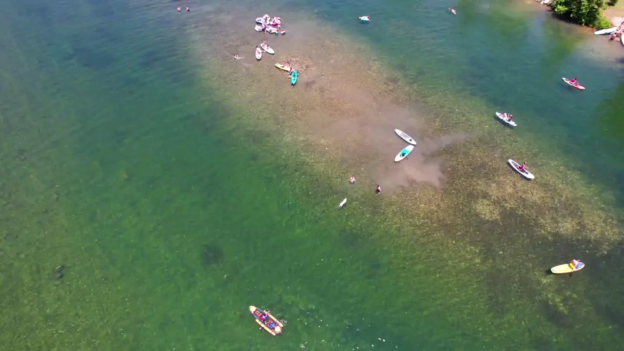 Aerial footage of people swimming at Jessica Hollis Park in Austin