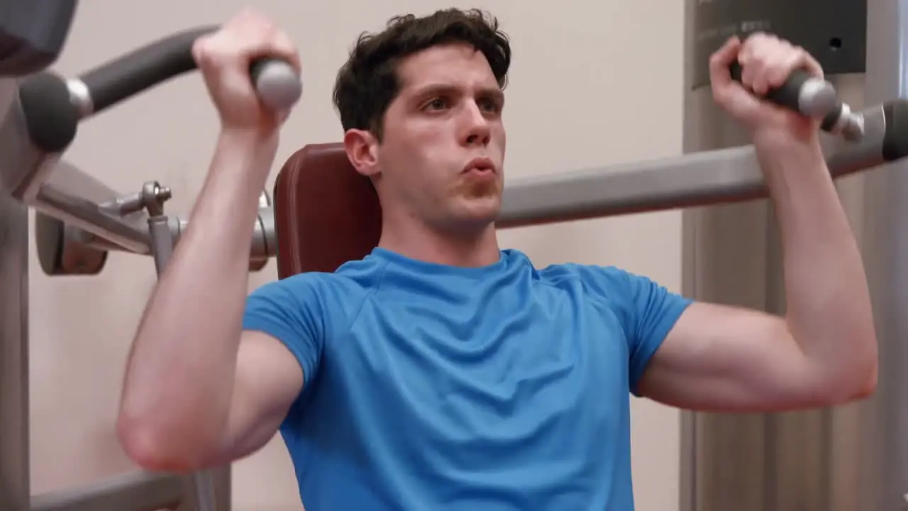 Man using weights machine in gym