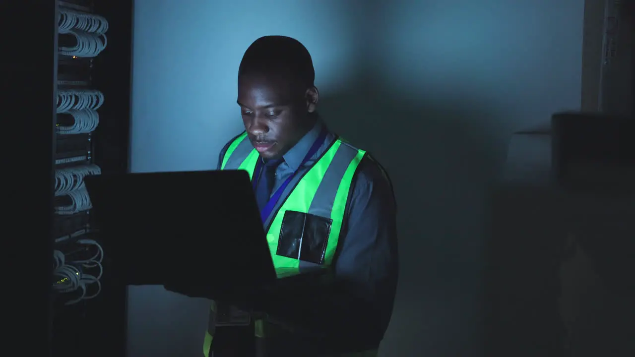 Black man laptop and control room