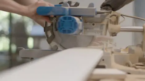 Medium Shot of a Circular Saw Being Used to Cut Skirting Board