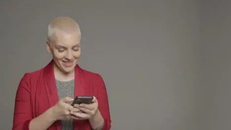 Female model posing with smartphone during studio portrait 05