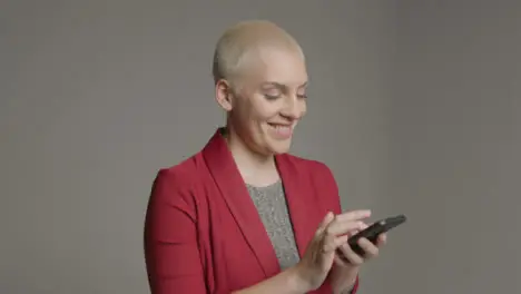 Female model posing with smartphone during studio portrait 06