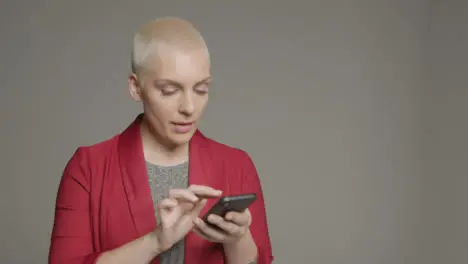 Female model posing with smartphone during studio portrait 07