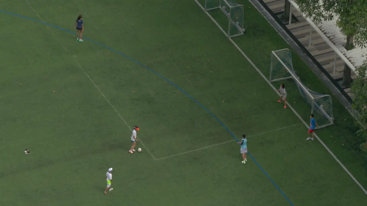 Overhead view of group of teenagers playing football