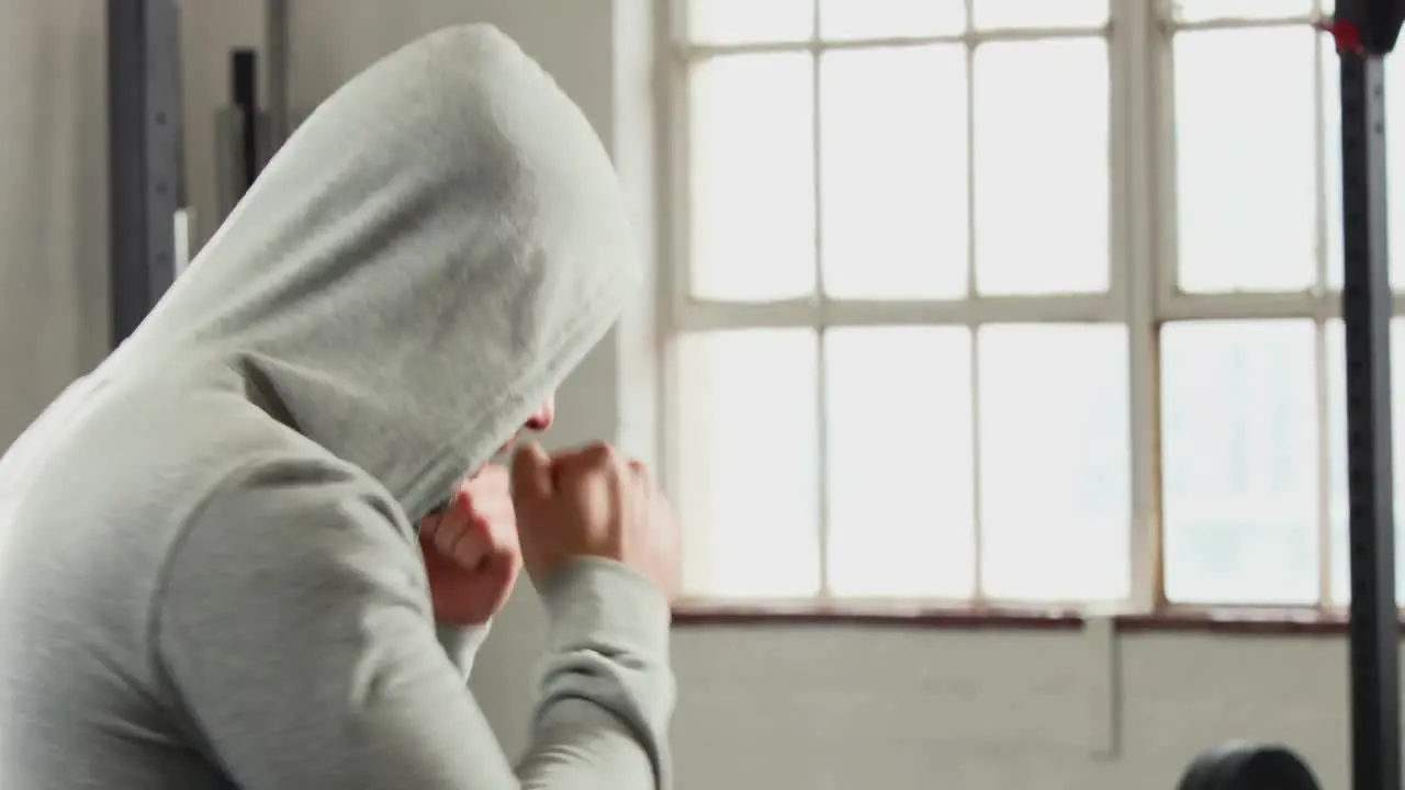 Fit man shadow boxing in gym