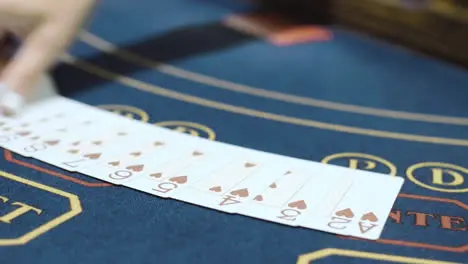 Playing cards laid out in row on table before playing poker Gambling in casino