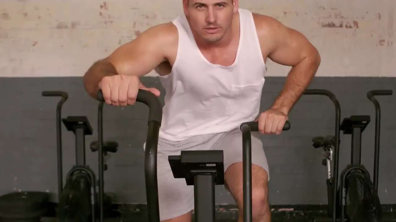 Fit man working out on the exercise bike