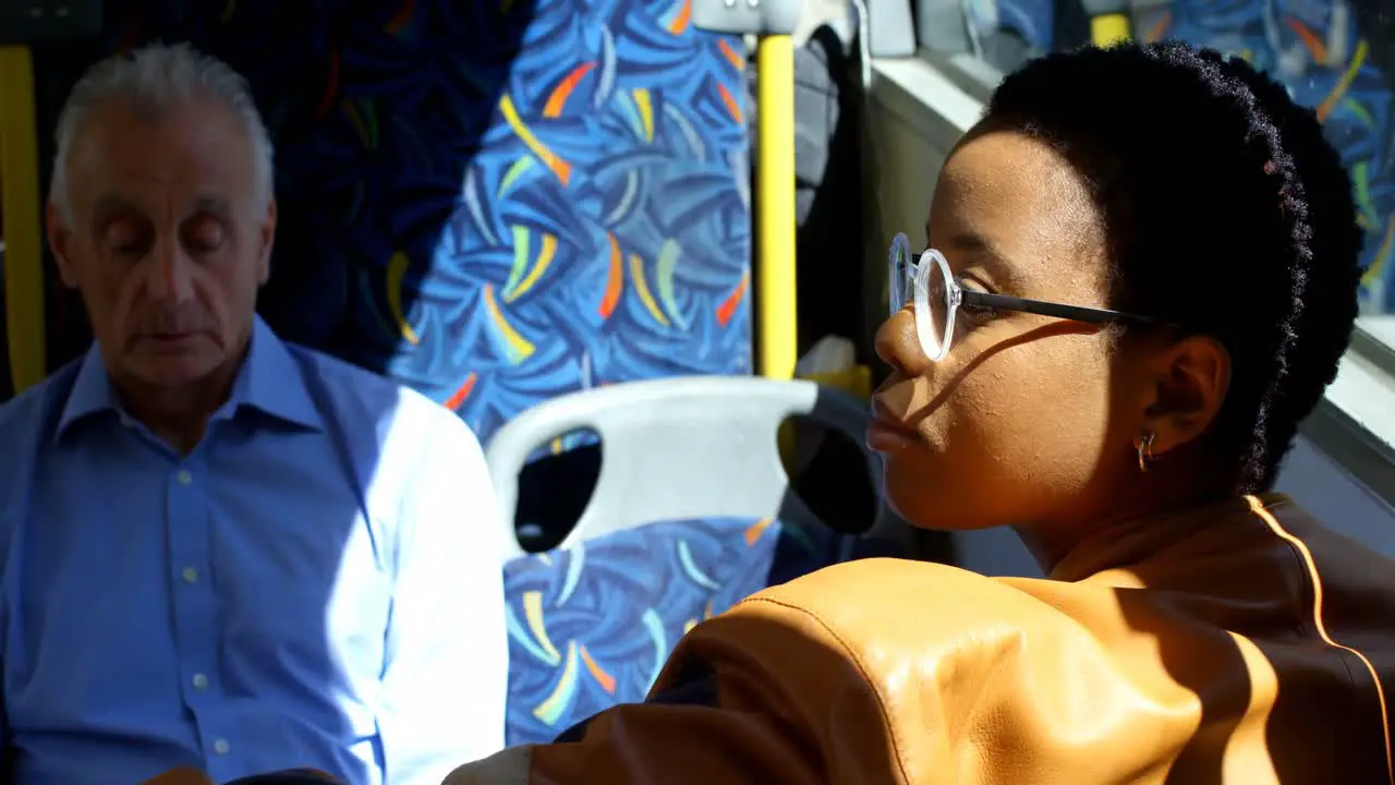 Female commuter travelling in bus 4k