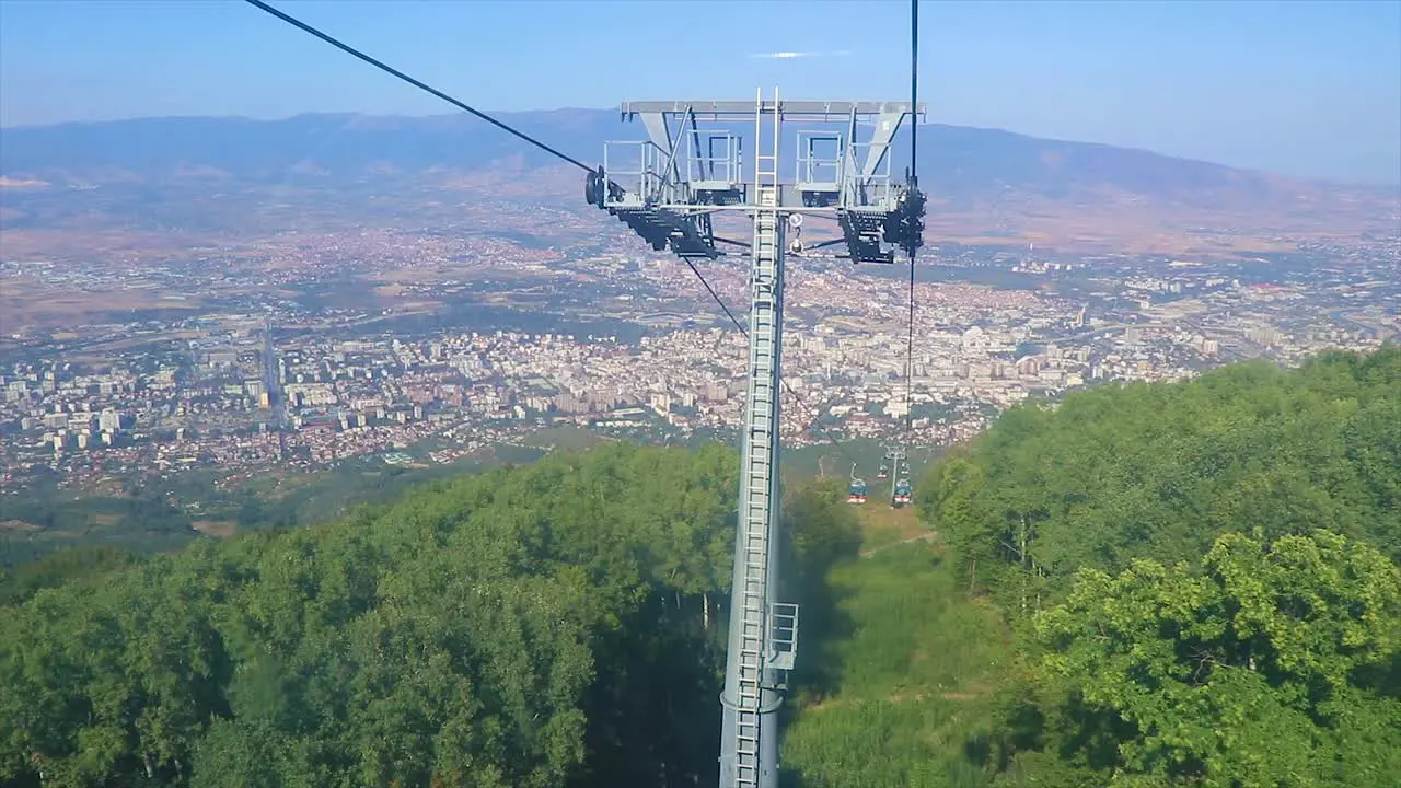 Panoramic view of an urban town from a cable car in the mountains