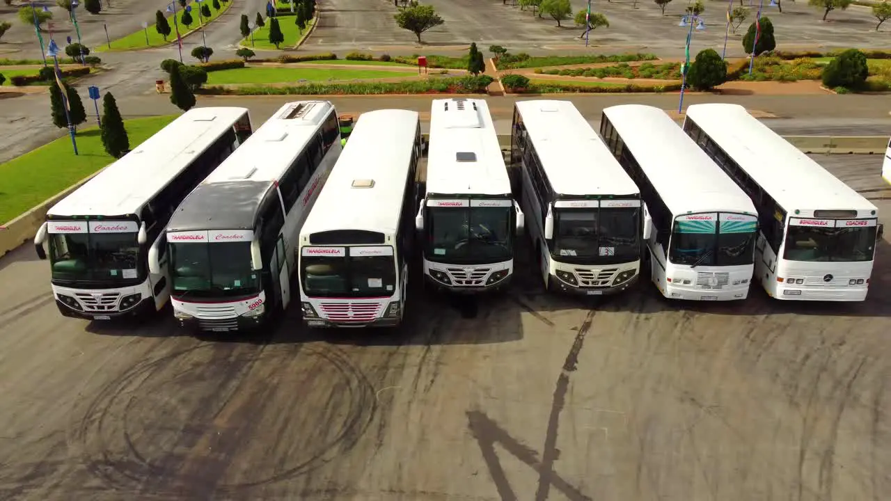 Aerial drone view of a line of parked busses