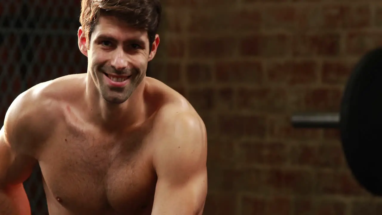 Smiling athlete preparing to do a workout