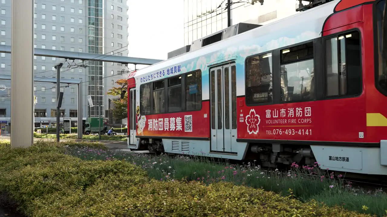 Toyama Light Rail Tram Slowly Departing Station