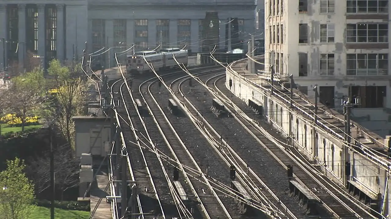 One Of Chicago'S Famed Els"" Rounds A Corner And Heads Down The Elevated Tracks Past Nondescript Buildings""