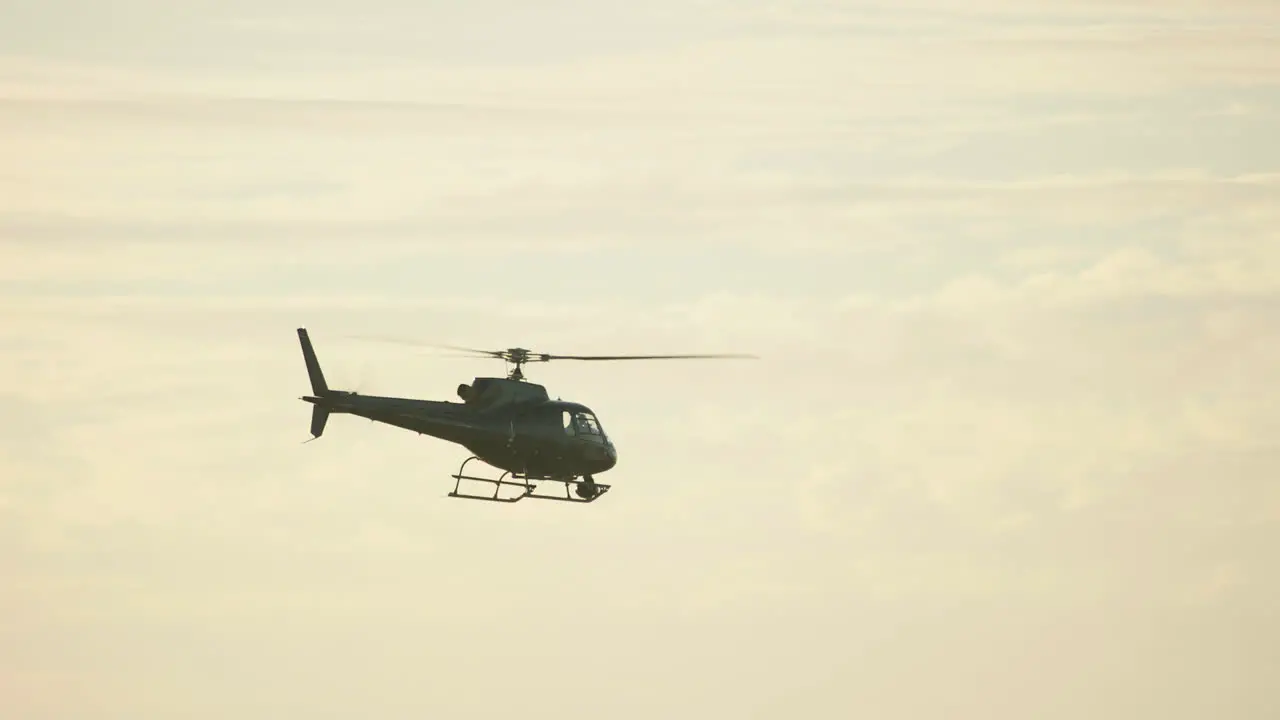 A helicopter flys through the desert in Morocco