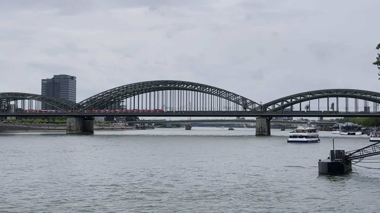 Bridge made of shalt struts and metal over which an S-Bahn runs Hohenzollern Bridge in Cologne over the Rhine