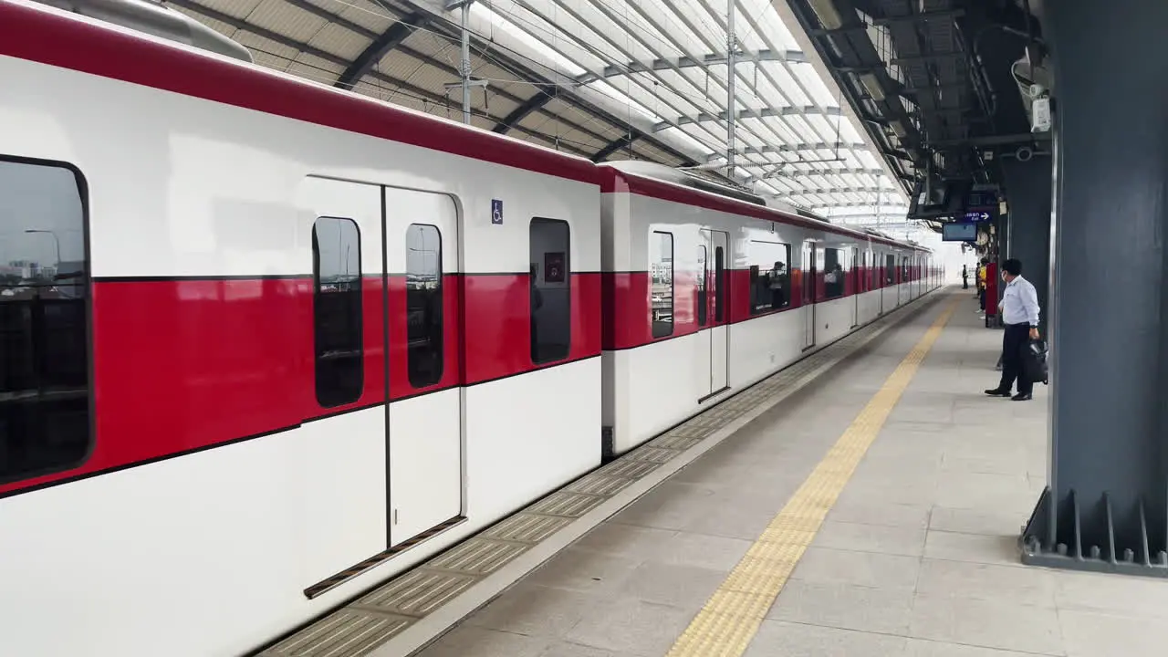 Train Arriving at Lak Si Station on SRT Dark Red Line in Bangkok Thailand