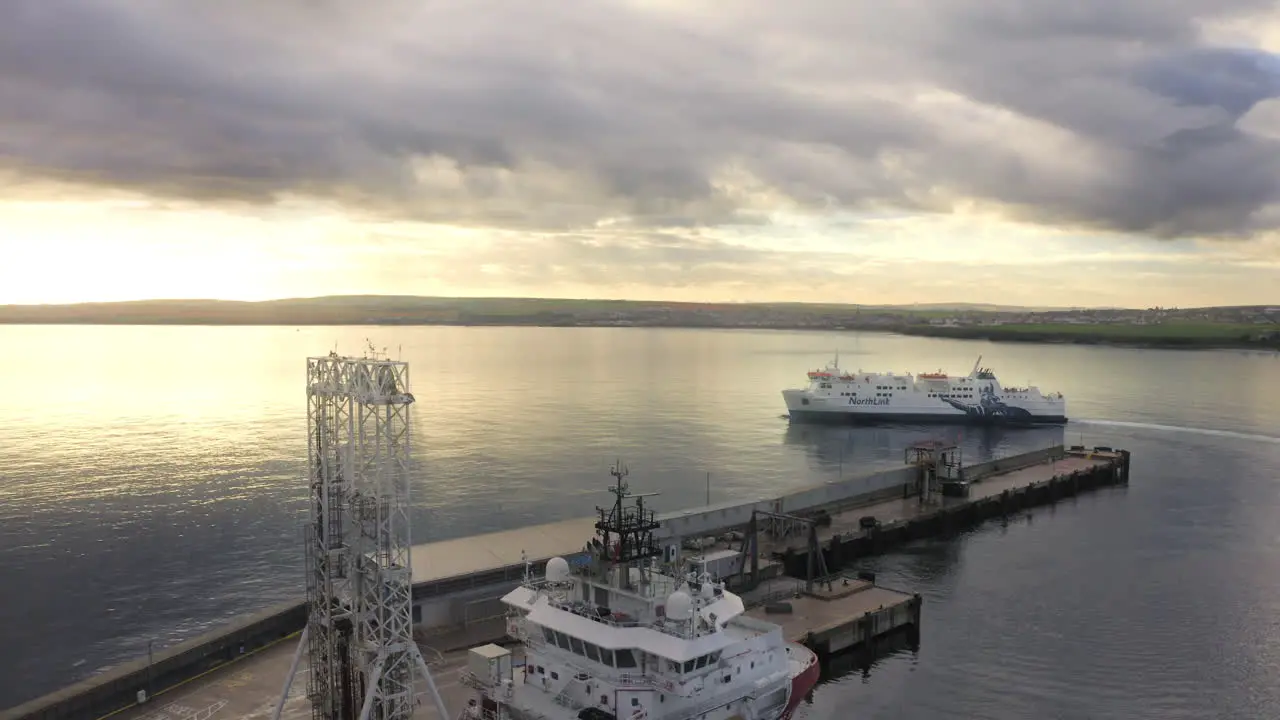 Ferry departing from harbour into beautiful sunset