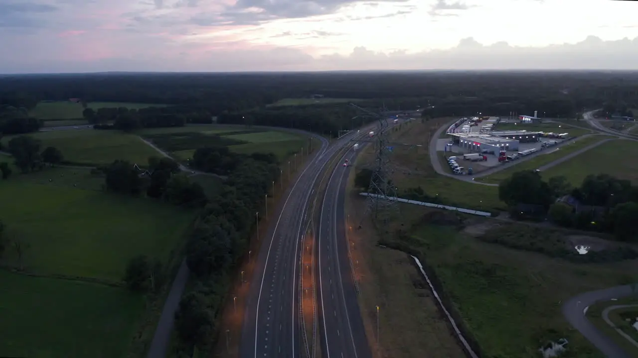 Aerial Slide above European Freeway at Sunset with Car traffic