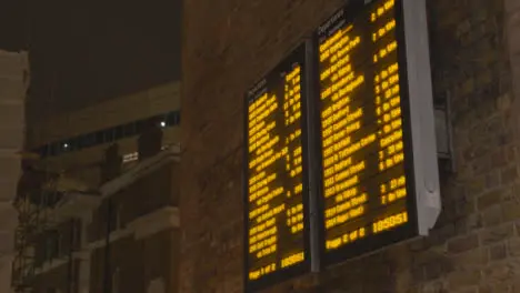 Close Up Of Departure Board At London Bridge Rail Station In London UK At Night