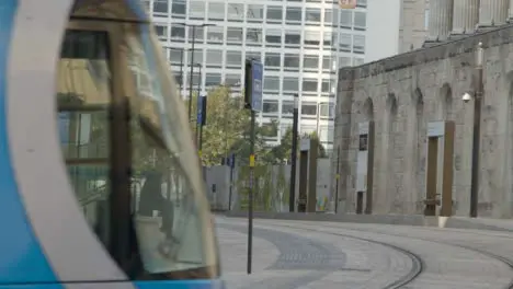 Two People Waiting for a Tram In Birmingham