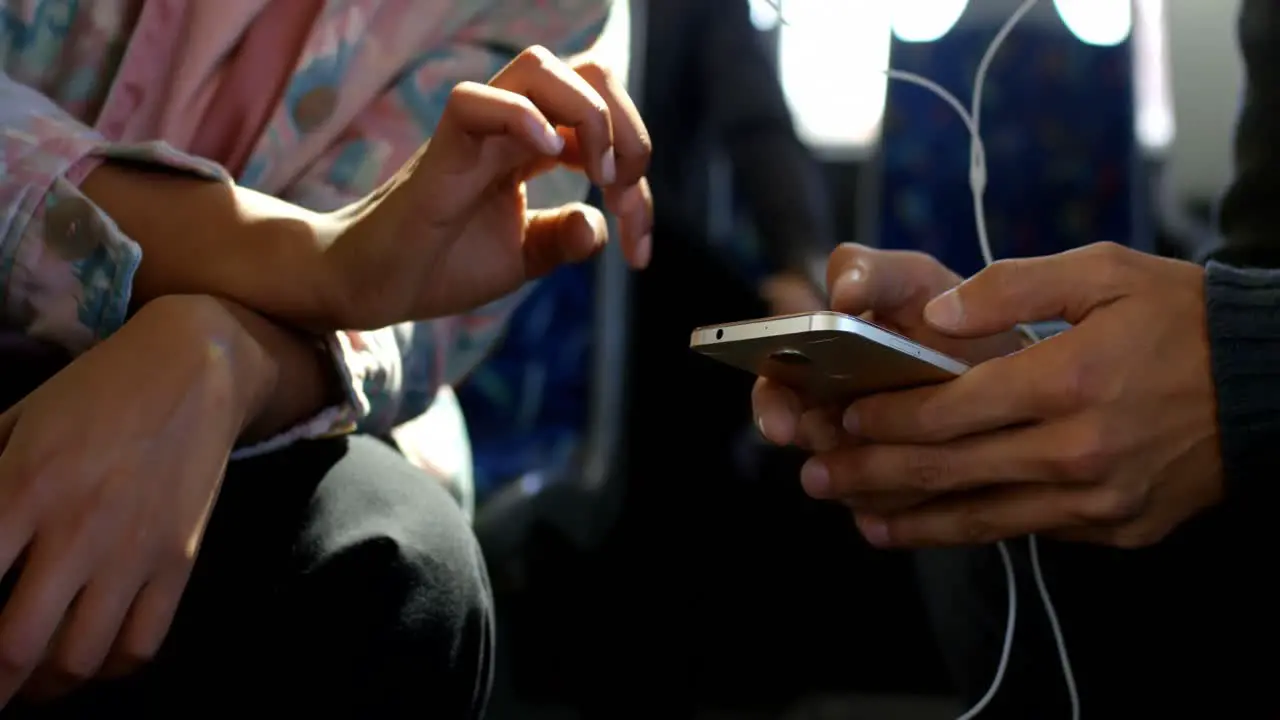 Commuters using mobile phone while travelling in bus 4k