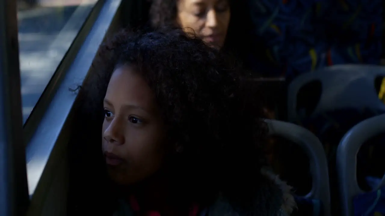 Girl looking through window while travelling in bus 4k