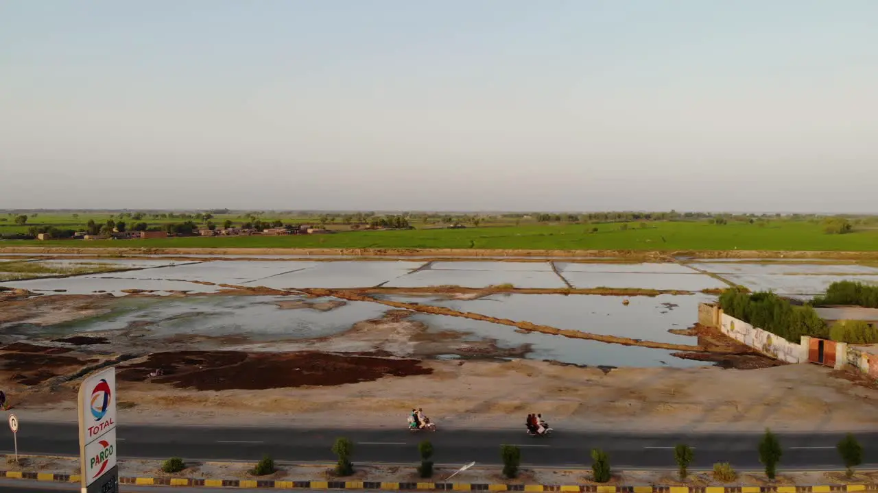 Aerial View From Across Truck Stop In Rural Sindh Of Flooded Fields