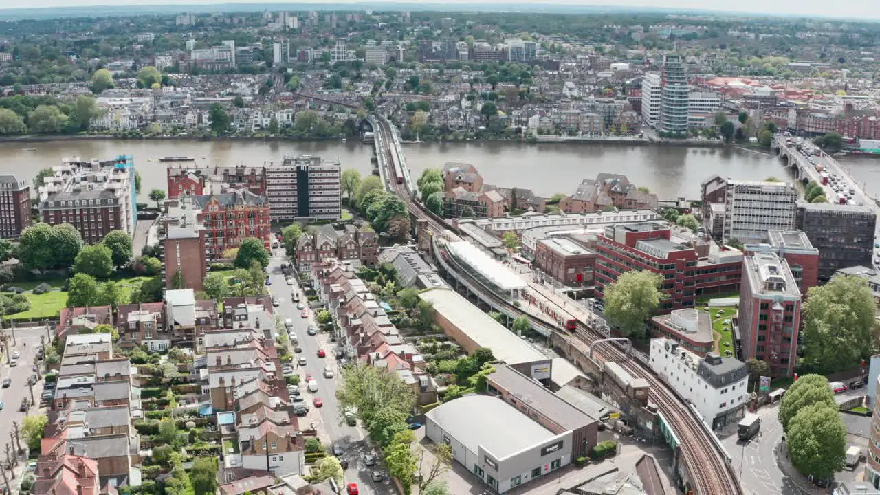 Stationary aerial drone shot of Putney bridge Tube station West London