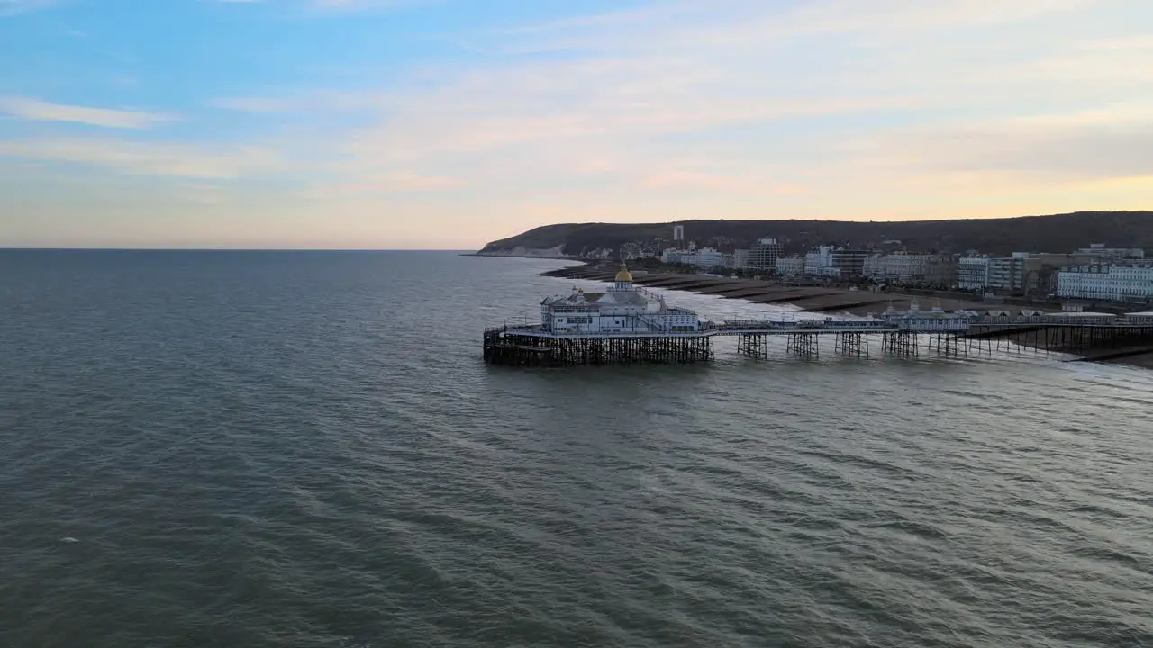 Eastbourne Pier and town at Sunset Sussex Uk Aerial wide POV view 4K