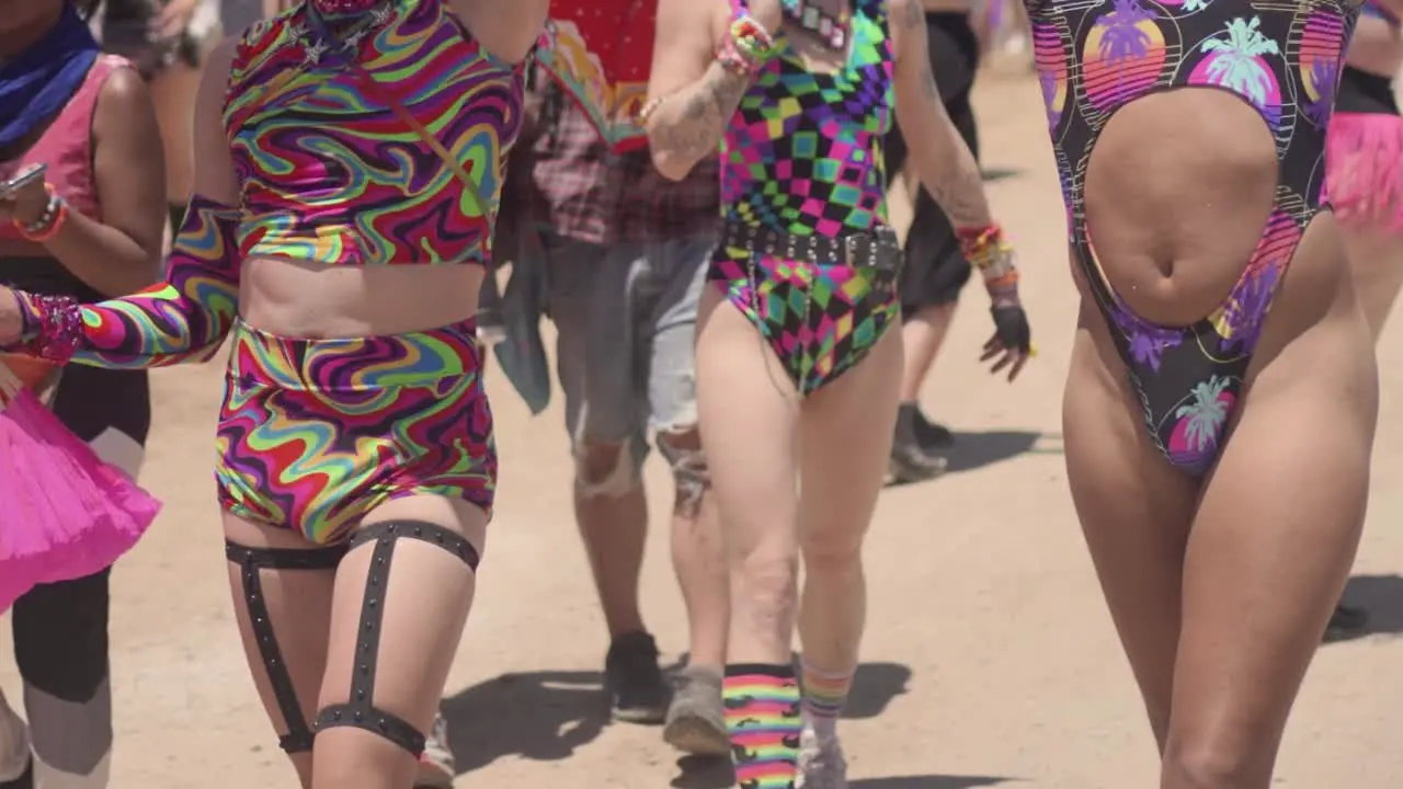 A lower view of people walking in the festival