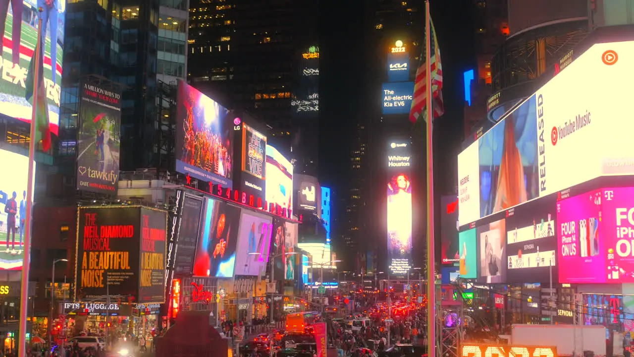 Bustling Times Square At Night With Digital Billboards In New York City Manhattan USA